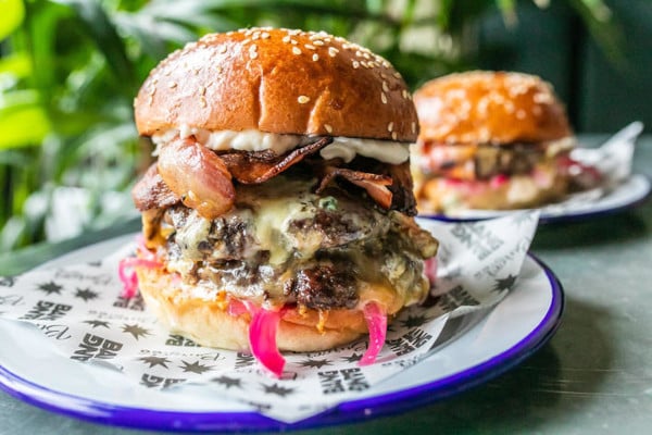 Juicy burgers on blue plates
