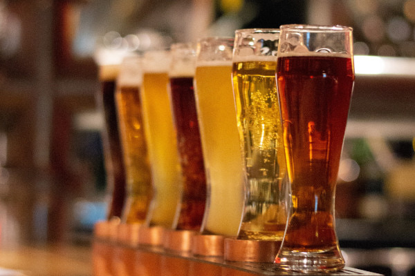 Beers lined up on a bar