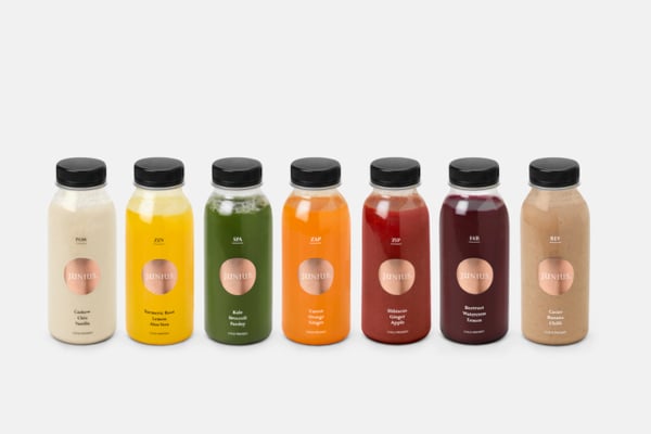 colourful booster bottles on grey background