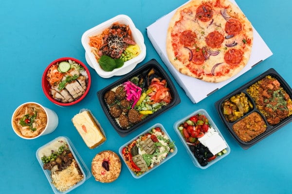 loads of takeaway food items on blue background
