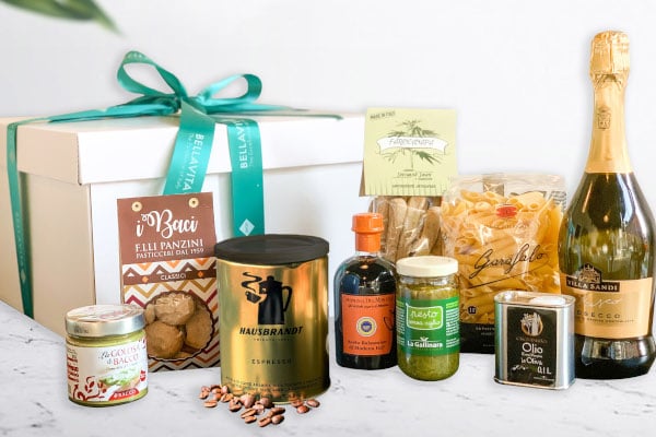 White box with blue ribbon and lots of food items