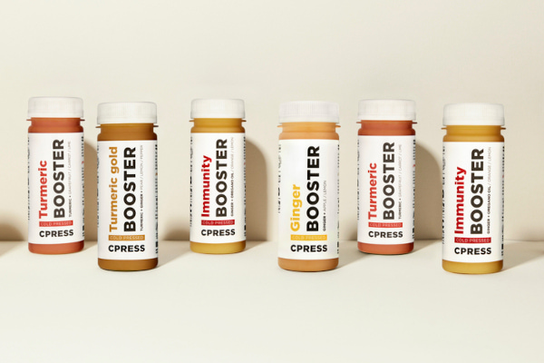 booster bottles lined up against cream background