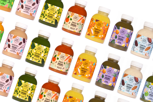 Colourful juice bottles lined up